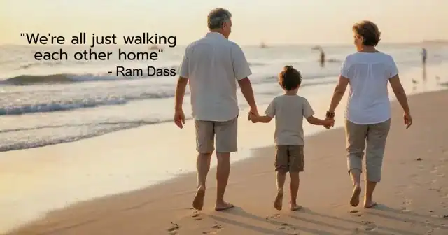A couple of grandparents walking on the beach with their granchild and creating lasting connecting moments.