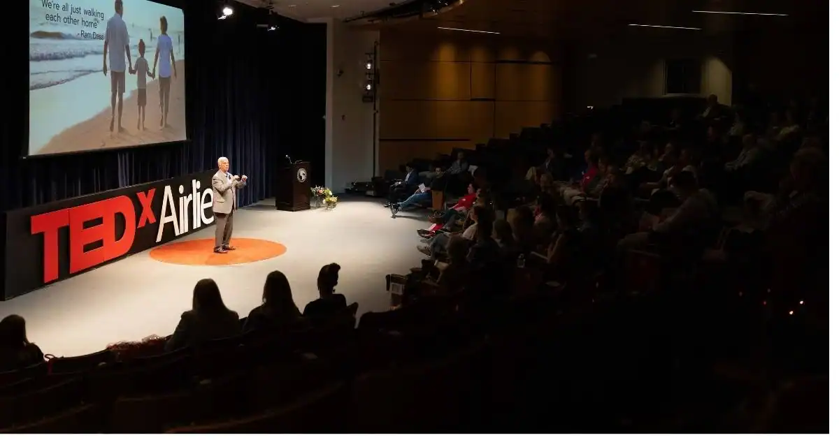 Neil Taft speaking at the TEDx Airlie, sharing insights from his book The Bridge To Your Grandchildren.