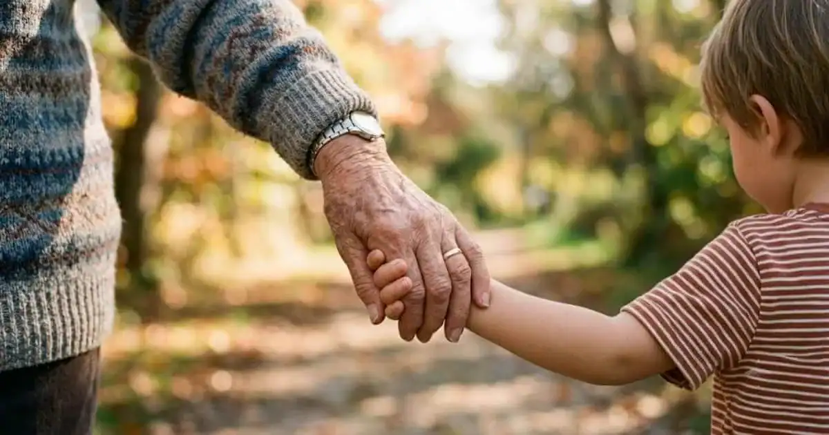 A close-up of a grandparent and grandchild holding hands, representing love and influence without control.